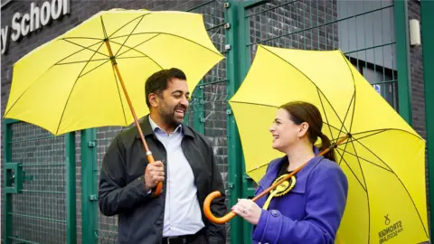 PA Media SNP leader Humza Yousaf and candidate Katy Louden