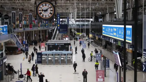 PA Media Commuters in Waterloo Station during the morning rush hour in London