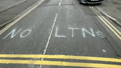 "No LTNs" spray painted on a road in East Oxford