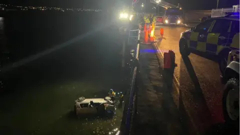 Isle of Man Constabulary Car pulled out of harbour off Battery Pier