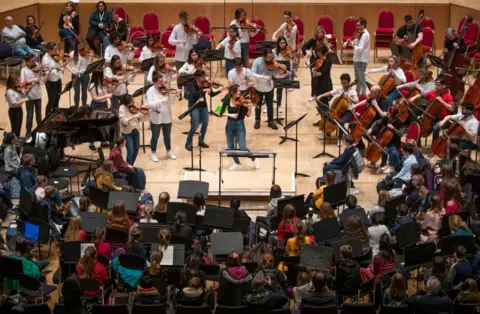 PA Violinist Nicola Benedetti performs with the Benedetti Foundation tutors and ambassadors for 350 young musicians at the first Benedetti Sessions at the Royal Concert Hall, Glasgow.