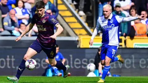 Bristol Rovers FC Players from Bristol Rovers and Peterborough compete for the ball at the Memorial Stadium on Saturday