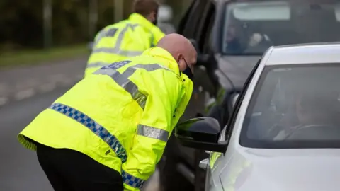 Getty Images Police stopping drivers