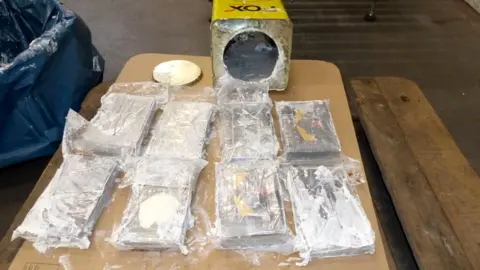 Reuters Cocaine found in over 1,700 tins of wall filler after German authorities seized more than 16 tonnes of cocaine in the northern port city of Hamburg, 24 February 2021