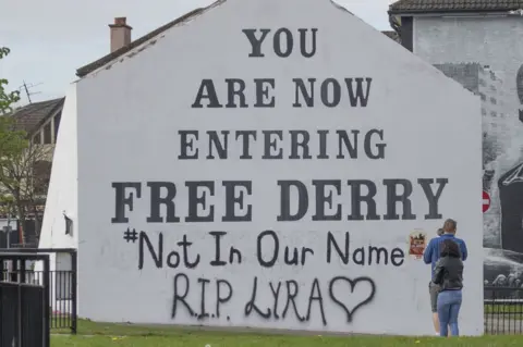 PA A message of condolence on the Free Derry mural in Londonderry