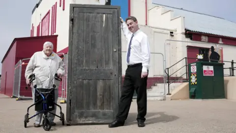 Stuart Boulton Joyce Dowding and Neil Bates with the original Larry Grayson door at The Regent in Redcar