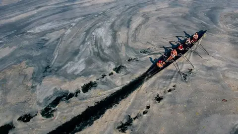 Yasin Akgul / AFP A boat on a lake