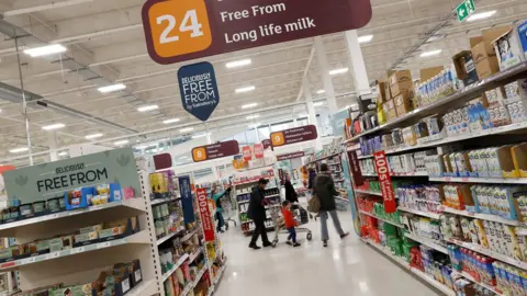 Reuters Long life milk aisle in Sainsbury's