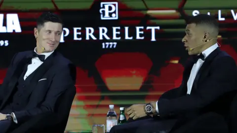 Poland striker Robert Lewandowski (left) and France forward Kylian Mbappe