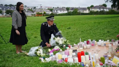 PA Media Priti Patel and Chief Constable Shaun Sawye