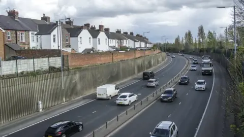 Getty Images Homes near a road