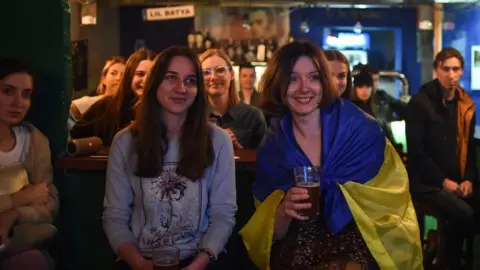 AFP Ukrainians watch the debate on TV