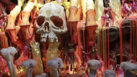 EPA Members of the Imperatriz Leopoldinense samba school perform during a parade at Avenida Marques de Sapucai in the Sambadrome, during the Rio de Janeiro Carnival, in