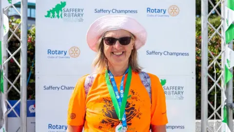 Saffrey Rotary Walk Ruth Mahy at the finish line.