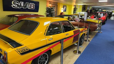 Car Museum showing hot rod-style cars lined up