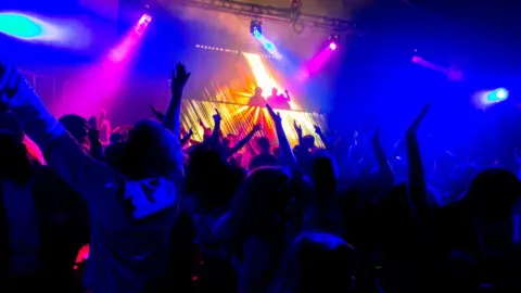 dangerous_disco Dancers with hands in the air