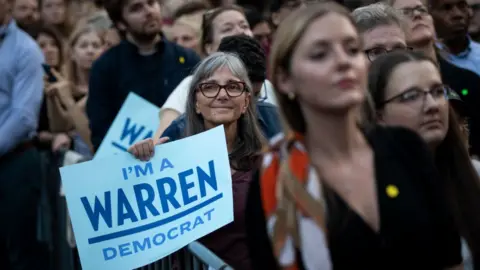 Drew Angerer/Getty Images Warren supporters at her 16 September rally