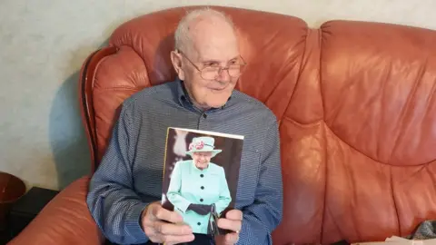 Steve Young Fred Young with a telegram from the Queen