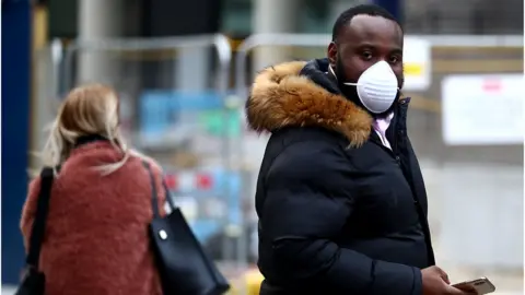 Reuters Man wearing face mask