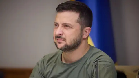 Getty Images Ukrainian President Volodymyr Zelenskyy speaks with the recently exchanged Ukrainian prisoners on September 21, 2022.