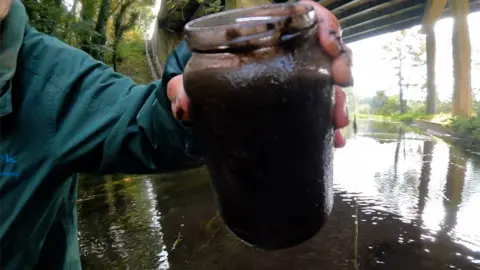 Jonah Fisher/BBC Jar of polluted water