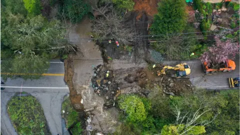 Getty Images Flooding washed away a major road in coastal Santa Cruz County on Friday
