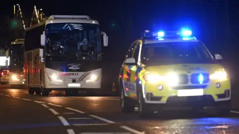 Getty Images Coach carrying quarantined Wuhan evacuees