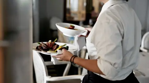 Klaus Vedfelt/Getty Images Waitress