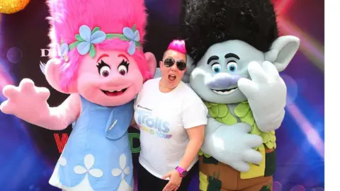 Getty Images The release of the movie Trolls: World Tour will happen concurrently in cinemas and online on 10 April.