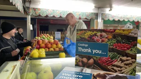 BBC Mark Smith serves his final customers at Queensgate Market
