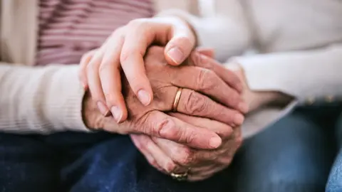 Getty Images Holding hands