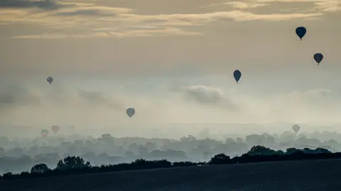 Charlotte Graham Hot air balloons flying over Castle Howard