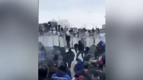 Protesters throwing snowballs at police in Russia