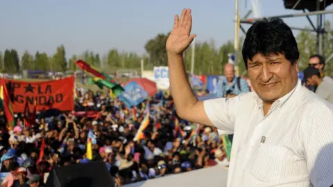 Getty Images Former Bolivian President Evo Morales, exiled in Argentina, takes part in a meeting organized by the Bolivianos Unidos group in Mendoza, to support the presidential candidate of the Movement to Socialism (MAS) party, Luis Arce, in Mendoza, Argentina, on March 07, 2020.