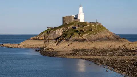 Getty Images Mumbles Lighthouse at low tide