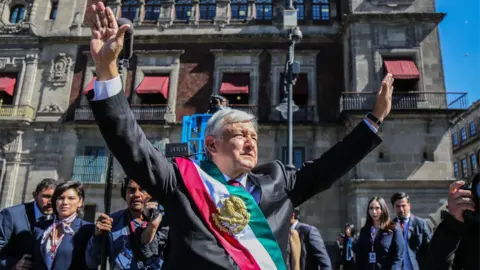 EPA The new President of Mexico, Andres Manuel Lopez Obrador (C), arrives at the National Palace, in Mexico City