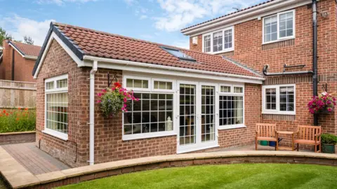Getty Images A rear extension on a detached house