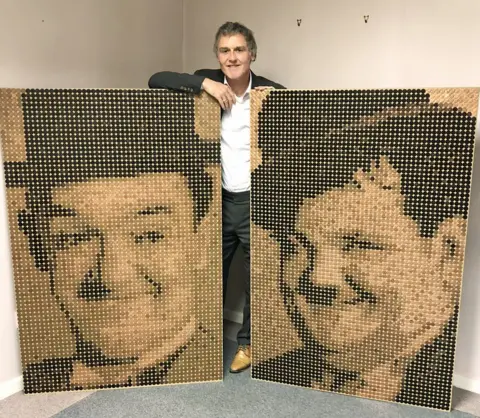 Ed Chapman/PA Julian Pickford, with coin portraits of Laurel and Hardy, which he commissioned his friend, renowned mosaic artist Ed Chapman, to create to mark the forthcoming world premiere of a biopic of the comedy legends.
