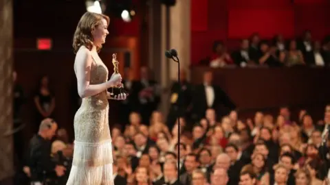 Getty Images Emma Stone accepts Best Actress award at the Academy Awards