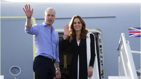 EPA The Duke of Cambridge and Catherine, Duchess of Cambridge wave as they depart from Islamabad airport in Islamabad in Pakistan on 18 October 2019.