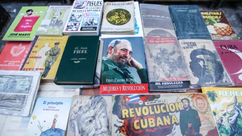 Getty Images A view of a street stand with Fidel Castro, Raul Castro, Che Guevara and Cuba related books, souvenirs and memorabilia for sale, in Havana's city centre