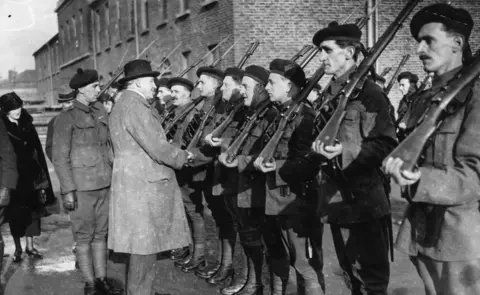Topical Press Agency/Getty Images Sir Hamar Greenwood of the RIC inspects a group of Black and Tans in 1921