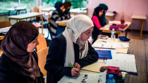 Getty Images Pupils study interpretations of the Koran's twelfth chapter, 16 October 2012