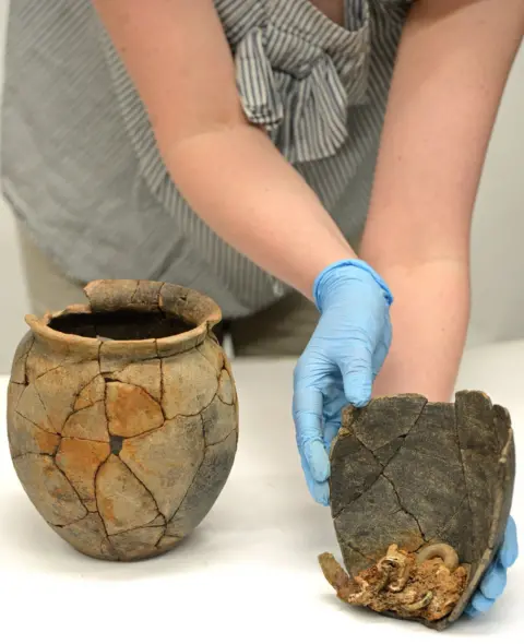 English Heritage Roman cremation urns, containing the remains of a young woman and a five-year-old child