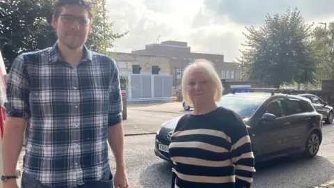 BBC Dr Scott Mabbutt and Danielle Stone on Cheyne Walk in front of Northampton Hospital's maternity unit