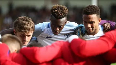 Getty Images Brendan Galloway in a huddle