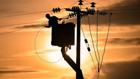 Jeff J Mitchell/Getty Power line repairs