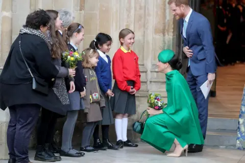 Chris Jackson/Getty Images Duke and Duchess of Sussex meet children outside Westminster Abbey