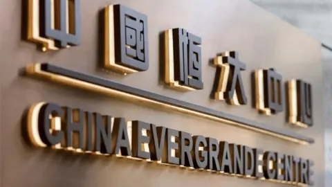 Reuters Evergrande sign.