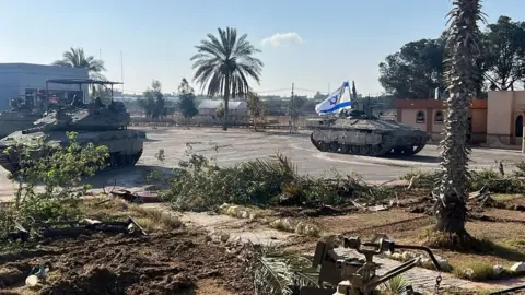 Reuters Israel Defense Forces (IDF) handout photo showing Israeli tanks at the Palestinian side of the Rafah crossing between Gaza and Egypt (7 May 2024)